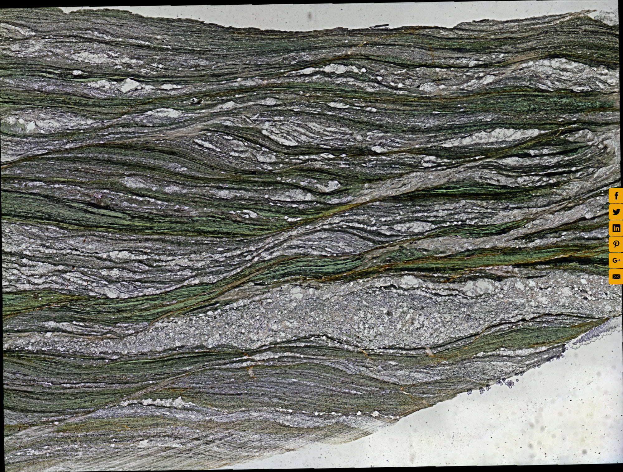 Extensional Shear Bands in Thin Section